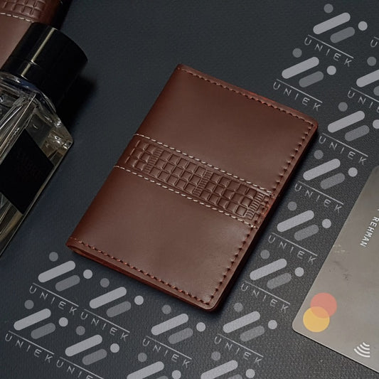 Minimalist Leather Wallet with Integrated Money Clip and Card Slots.