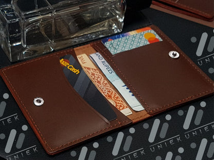 Minimalist Leather Wallet with Integrated Money Clip and Card Slots.