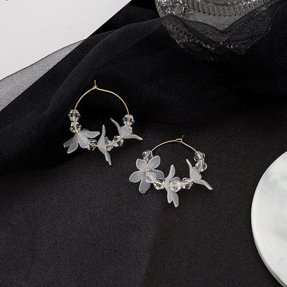 Golden needle transparent petal earrings